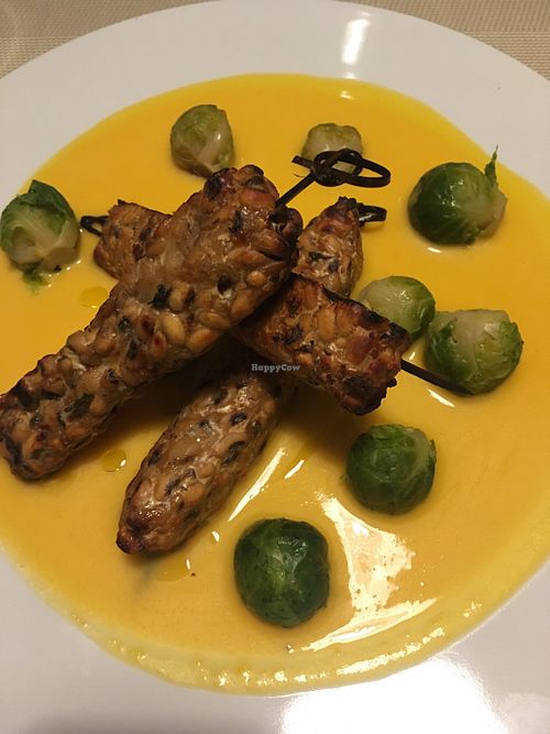 Tempeh skewers, Brussels sprouts, and vegan béarnaise at Soul Kitchen in Genoa