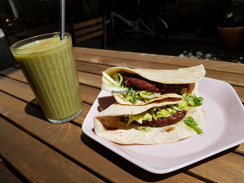 Sprouted lentil burger with the smoothie of the day (apple, banana, cinnamon, parsley) at Solar Kitchen Bar in Larnaca