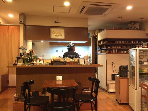 Part of the seating area, viewing the open kitchen at Tofu Room Dy's in Tokyo