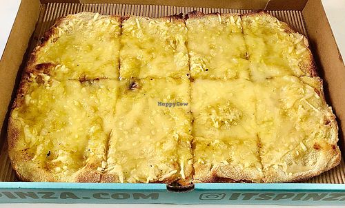 Cheesy garlic pizza at PINZA - Jumeirah Village Circle in Dubai