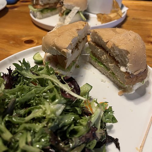 Fried chicken sandwich with garden salad  at The Office in St Catharines